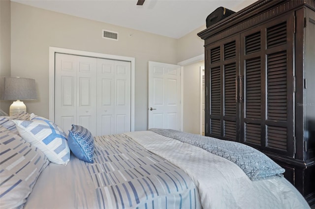 bedroom with ceiling fan and a closet