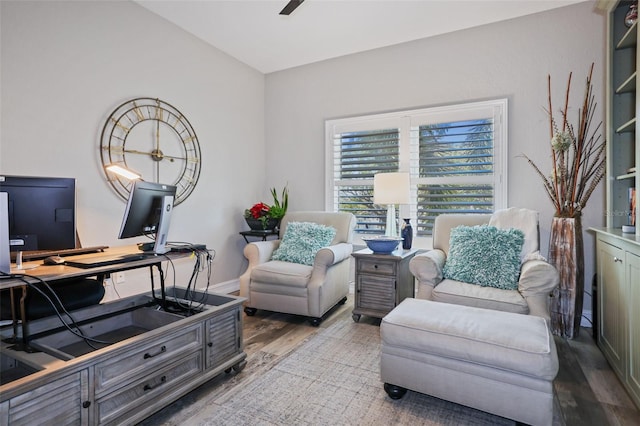 sitting room featuring light wood-type flooring and ceiling fan