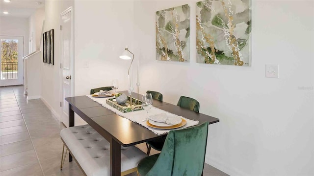 dining area with light tile patterned flooring