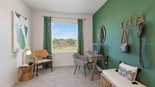 carpeted home office featuring lofted ceiling