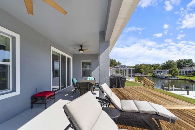 exterior space featuring a water view, area for grilling, and a lanai