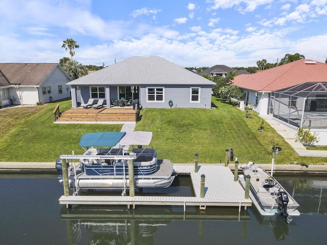 view of dock with a yard and a water view