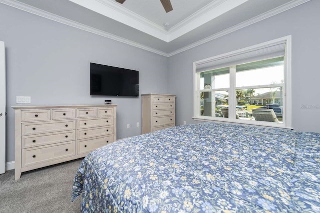 bedroom with light colored carpet, a raised ceiling, ceiling fan, and crown molding