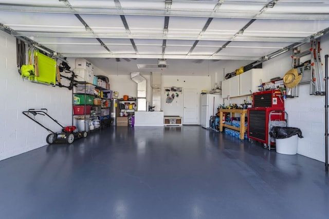 garage featuring white fridge