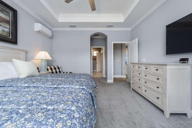 15 Cold Spring Ct, Palm Coast, FL 32137 - bedroom with a raised ceiling, a wall mounted AC, light carpet, arched walkways, and crown molding