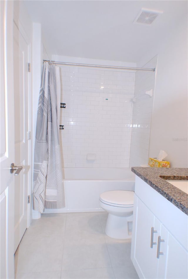 full bathroom featuring tile patterned floors, vanity, shower / bath combination with curtain, and toilet