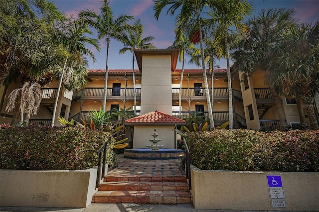 view of outdoor building at dusk