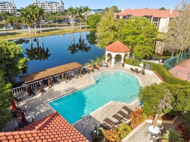 view of swimming pool featuring a gazebo, a water view, and a patio