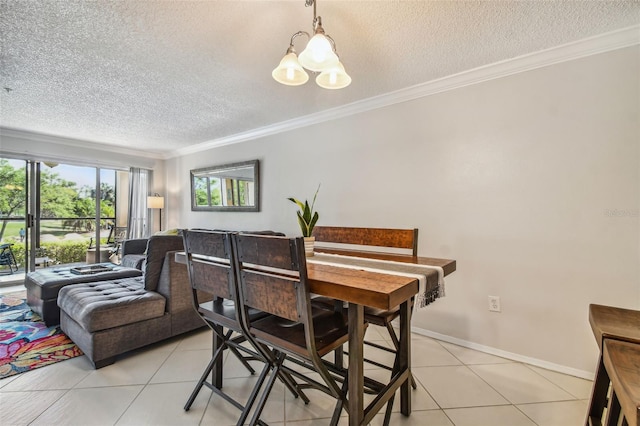 dining area with light tile patterned flooring, a textured ceiling, and ornamental molding