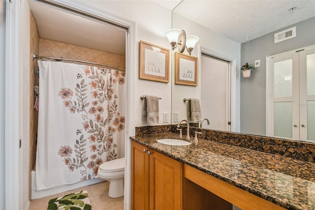 full bathroom with shower / bath combo, tile patterned flooring, a textured ceiling, toilet, and vanity