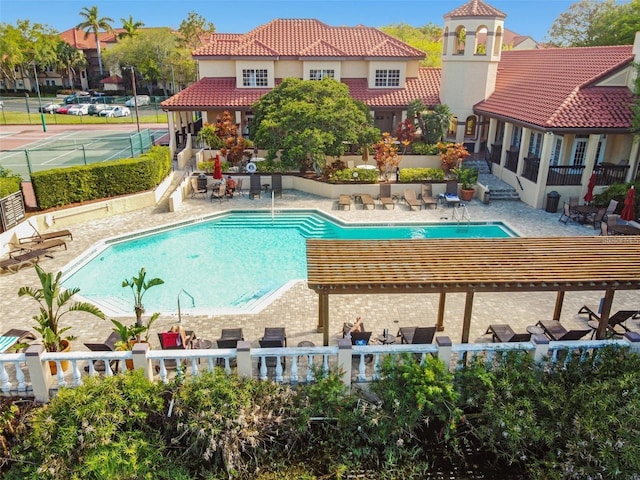 view of pool featuring a pergola and a patio