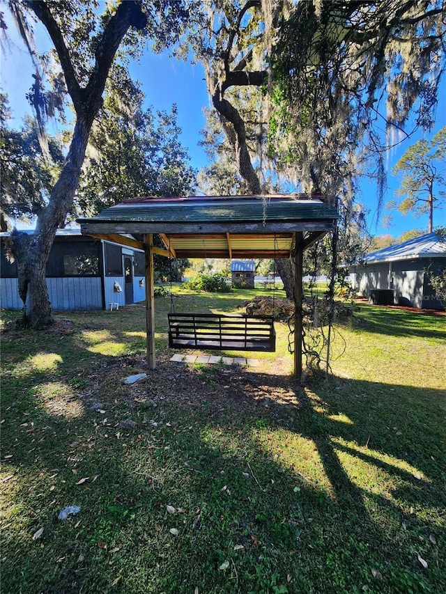 view of home's community with a yard