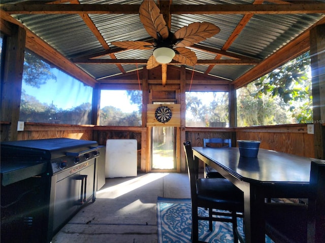 sunroom / solarium with lofted ceiling with beams and ceiling fan