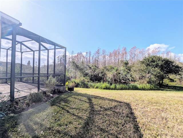 view of yard featuring a lanai