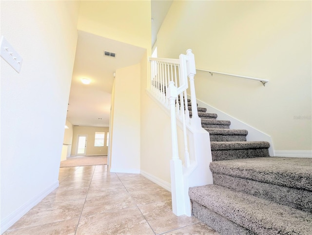 stairs with a towering ceiling