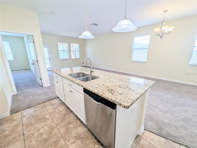 kitchen with dishwasher, plenty of natural light, white cabinetry, and hanging light fixtures