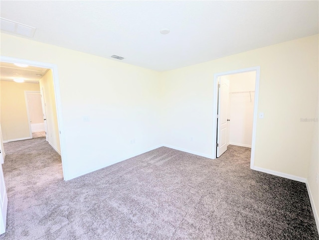 unfurnished room featuring light colored carpet