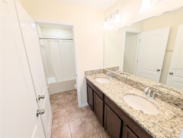 full bathroom with tile patterned floors, vanity, toilet, and shower / bath combo with shower curtain