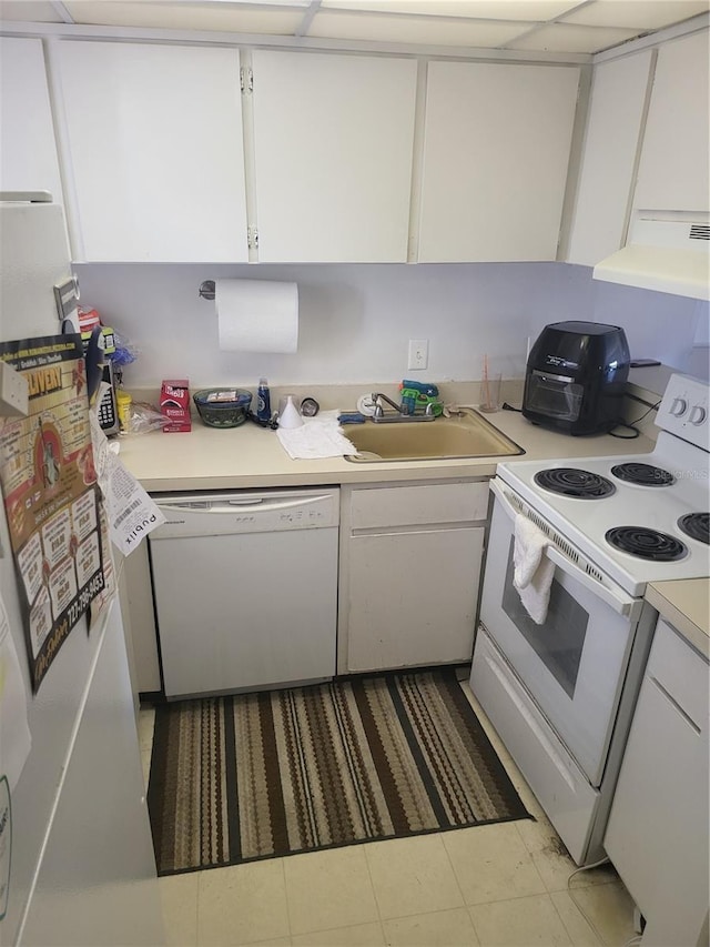 kitchen with white cabinetry, white appliances, sink, and range hood