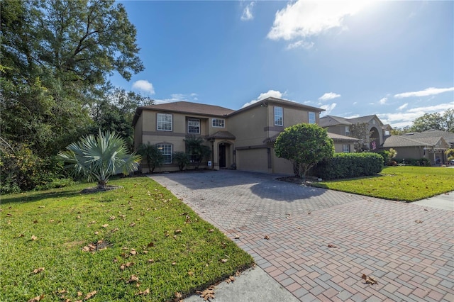 view of front facade featuring a front yard and a garage