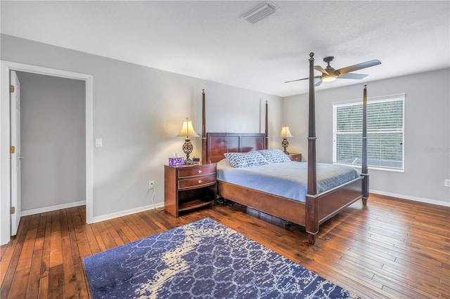 bedroom with ceiling fan and dark hardwood / wood-style floors