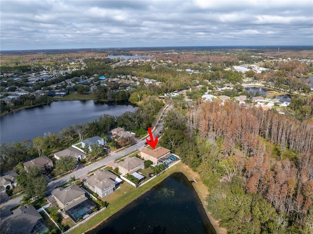 aerial view featuring a water view and a wooded view