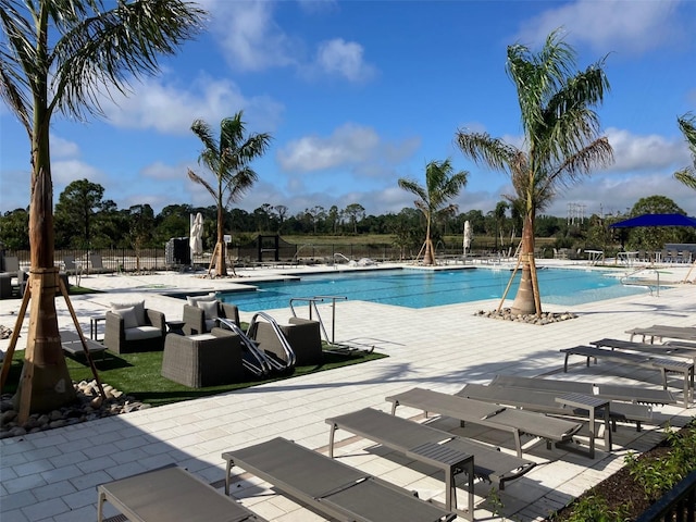 view of swimming pool featuring a patio area