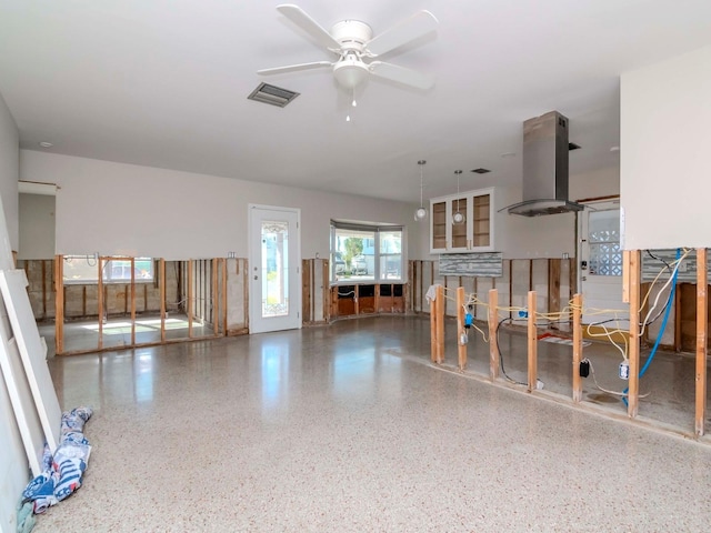 interior space featuring ceiling fan