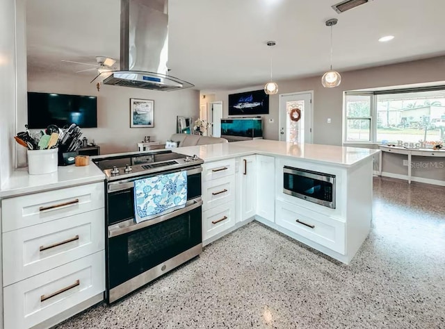 kitchen with island exhaust hood, kitchen peninsula, pendant lighting, white cabinets, and appliances with stainless steel finishes