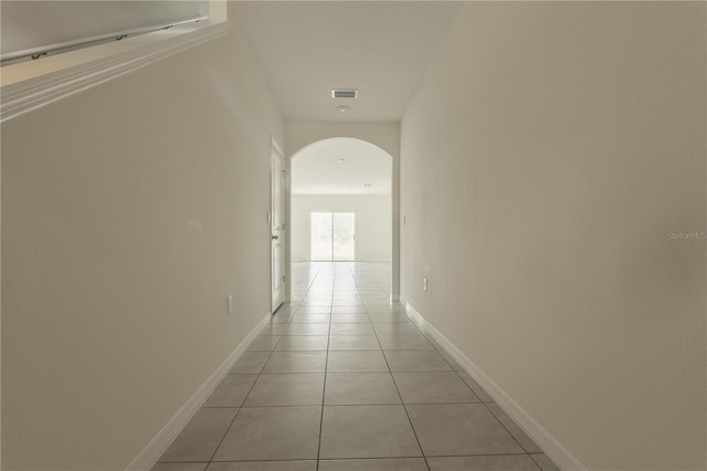 hallway featuring light tile patterned flooring