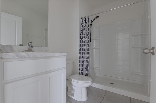 bathroom with toilet, a shower with shower curtain, vanity, and tile patterned floors