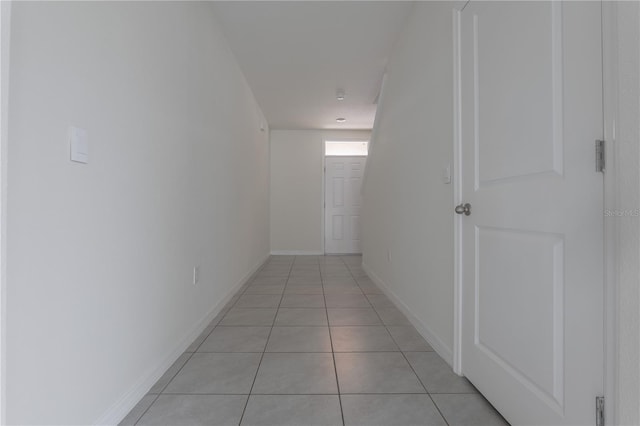 hallway with light tile patterned floors