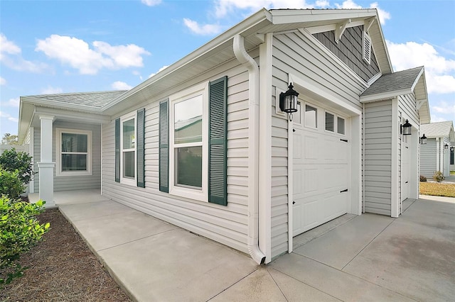 view of side of home featuring a garage