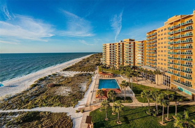 bird's eye view featuring a water view and a beach view