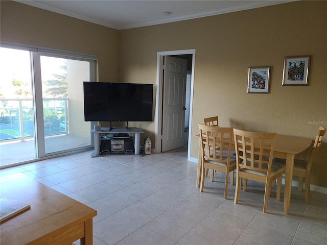 tiled dining room with ornamental molding