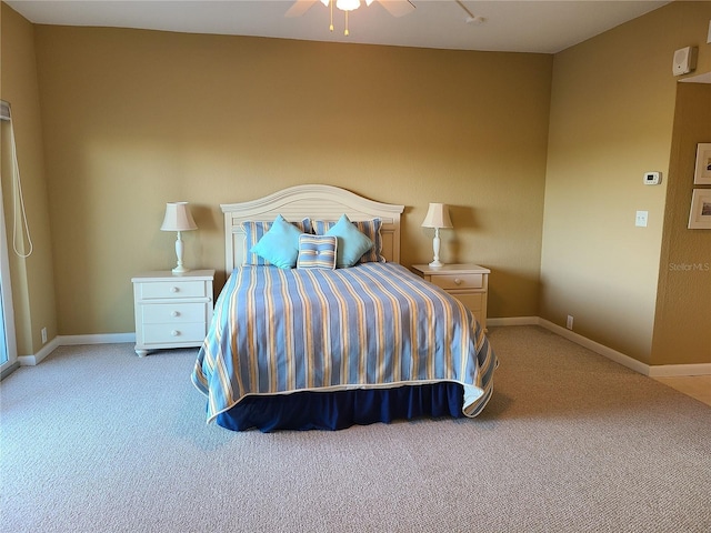 bedroom featuring light colored carpet and ceiling fan