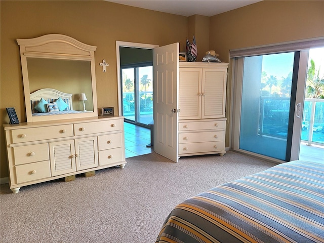 carpeted bedroom featuring access to outside