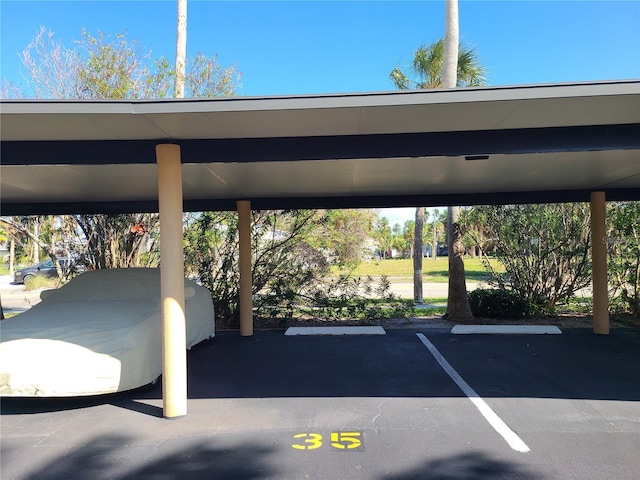 view of vehicle parking featuring a carport