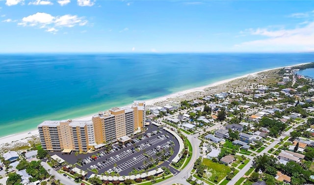 drone / aerial view with a water view and a view of the beach