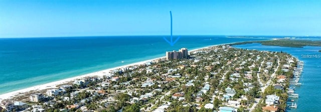 birds eye view of property featuring a view of the beach and a water view