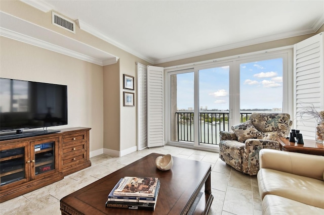 tiled living room with ornamental molding and a water view