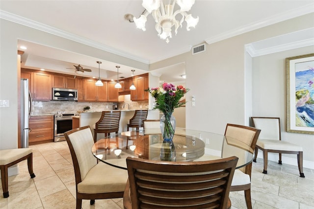 dining space with crown molding, ceiling fan with notable chandelier, and light tile patterned floors