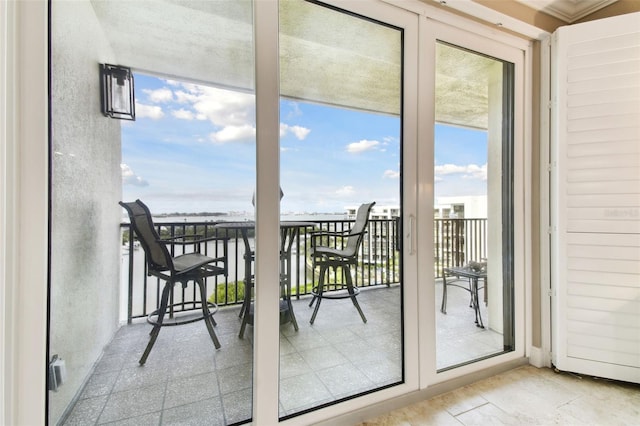 entryway featuring a healthy amount of sunlight and a water view