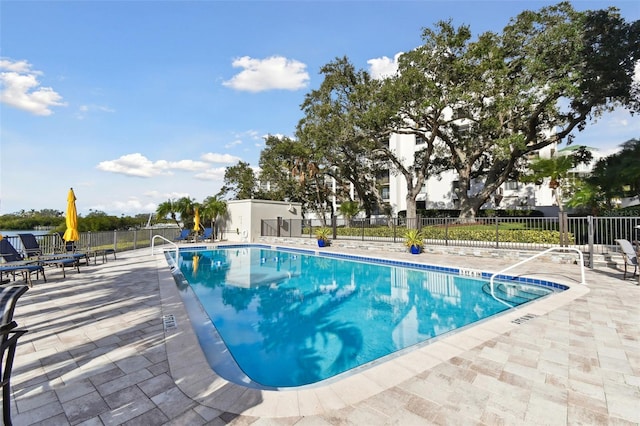 view of swimming pool with a patio area