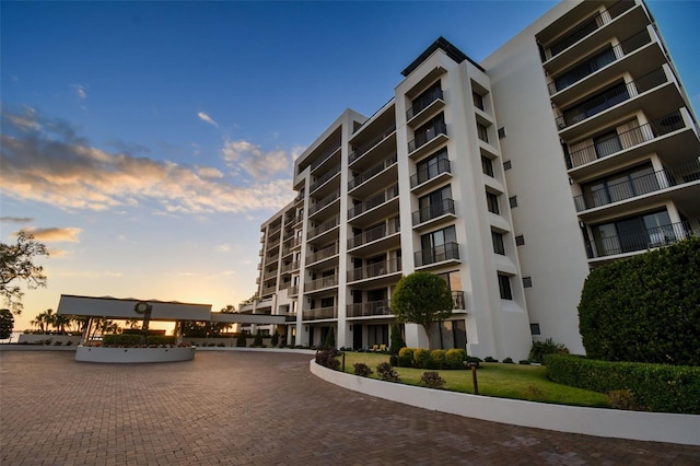 view of outdoor building at dusk