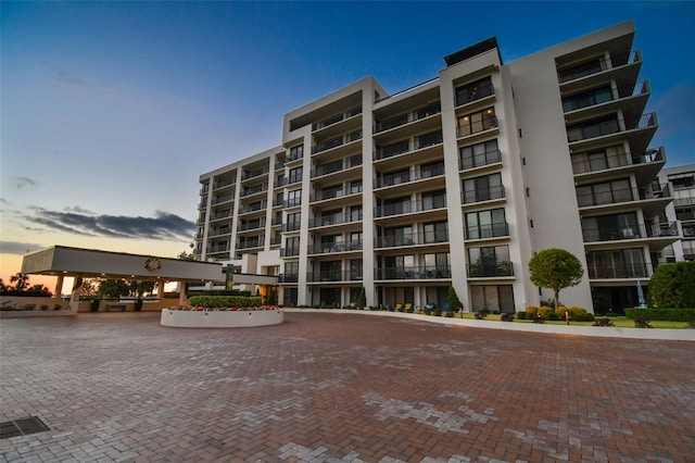 view of outdoor building at dusk