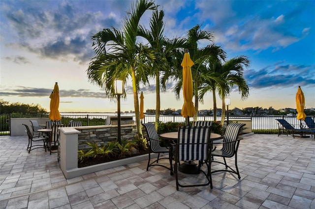 patio terrace at dusk with a water view