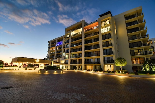 view of outdoor building at dusk