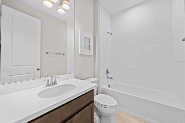 full bathroom with tile patterned flooring, toilet, vanity, and tiled shower / bath