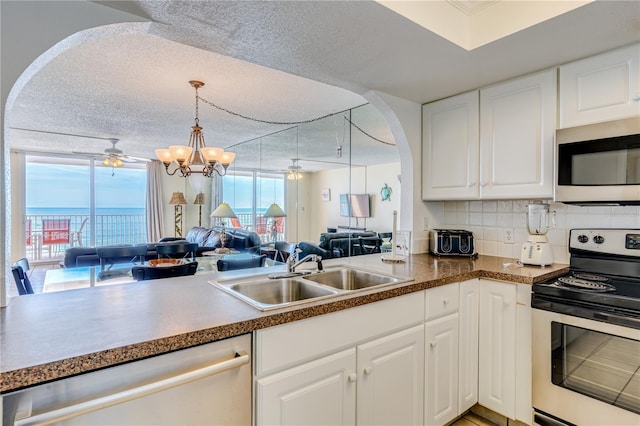 kitchen with white cabinets, sink, and stainless steel appliances